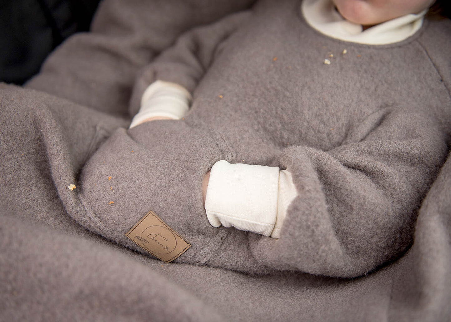 Ärmeldecke aus Merino